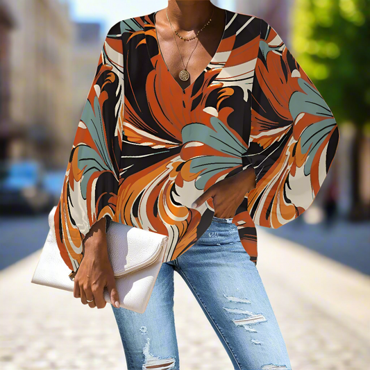 Swirling Orange and Blue Abstract V-Neck Chiffon Puff Sleeve Blouse by Luxtrini